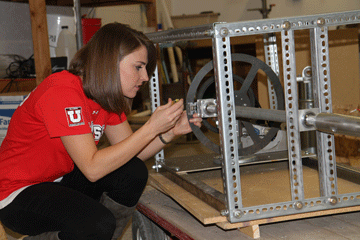 Louise Butler, working on her senior capstone project, Wave Energy Machine